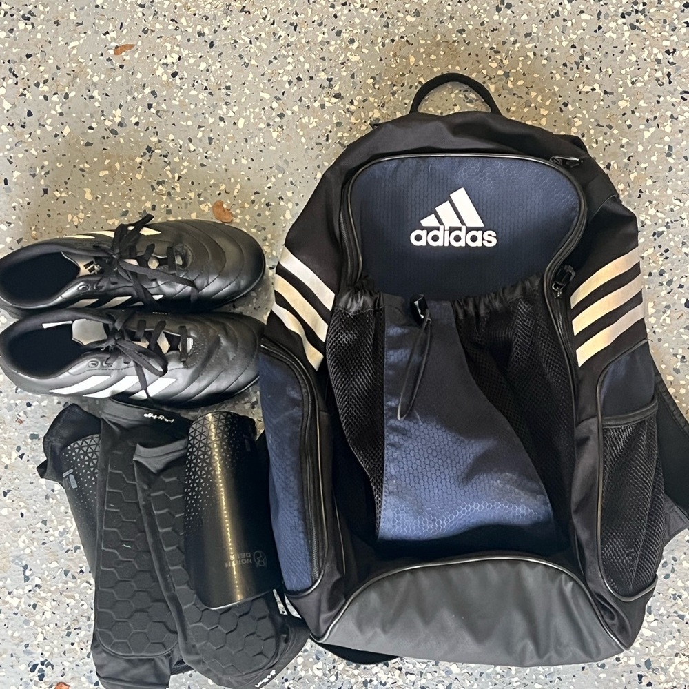 Adidas Black Backpack with Gold Accents and Durable Fabric